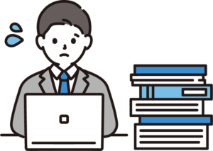 大量のExcelファイルに囲まれて悩む中小企業の担当者